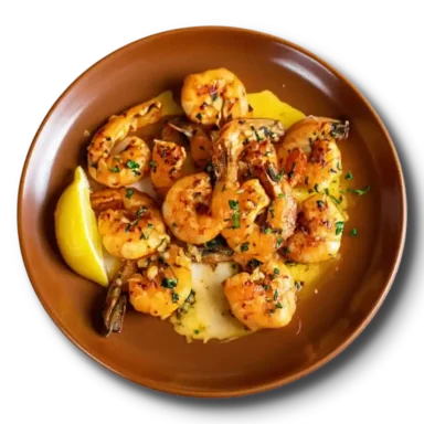 Жареные хвосты тигровых креветок с чесноком в соево-лимонном соусе